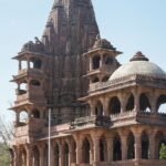 A stunning view of intricate historic temple architecture in Jodhpur's Mandore Garden.